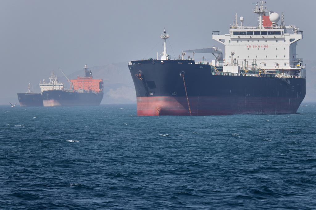 Cargo Ship Hit by Projectile in Strait of Hormuz Attack as Iran Issues New Warning
